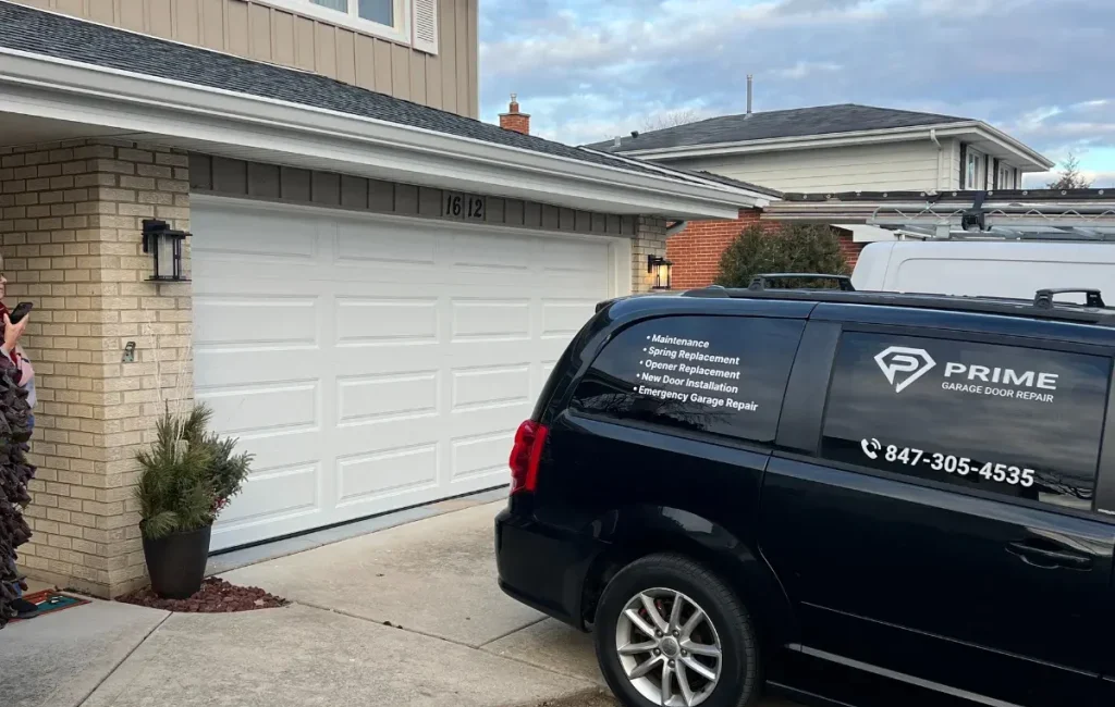 Emergency garage door repair sepcialists black car near white garage doors