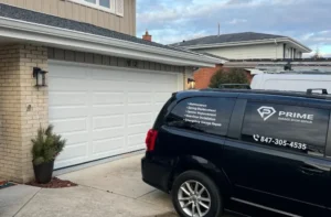 Emergency garage door services repair sepcialists black car near white garage doors