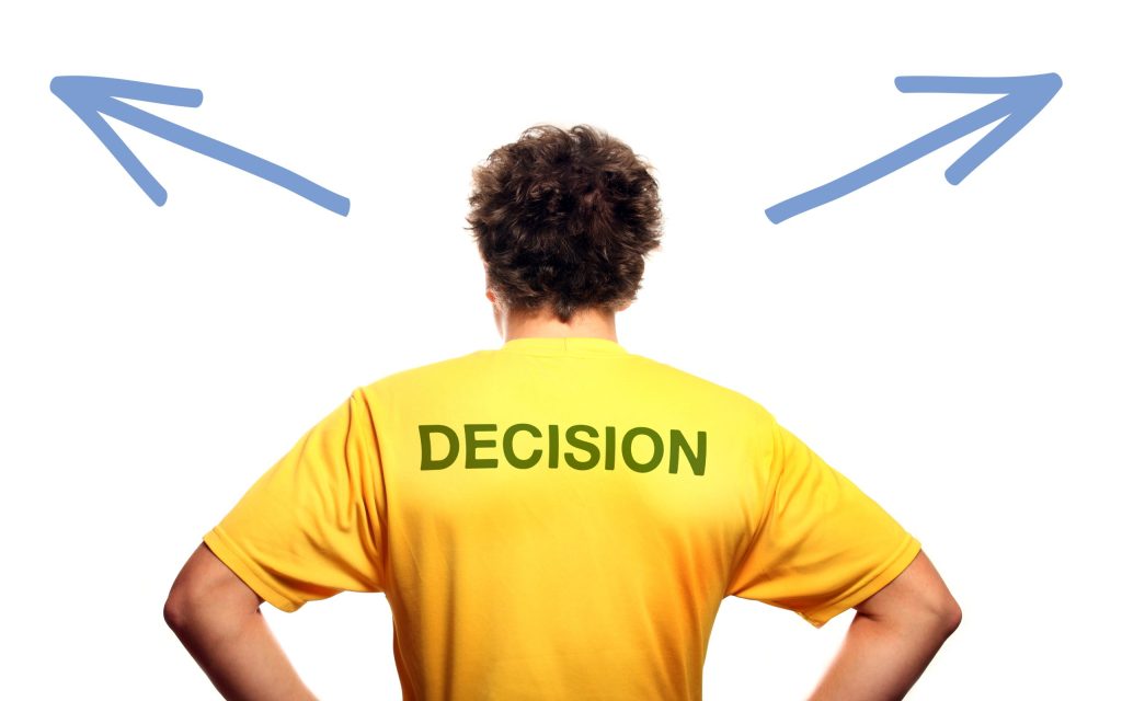 man standing against white background trying make decision