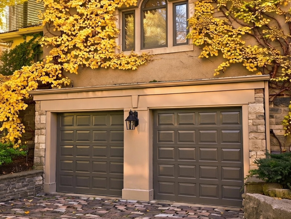 Style Garage Doors: 2026 Guide To Popular Designs &Amp; Trends For Chicago Homes Vine-Covered Stone Home Exterior Featuring Dark Gray Raised-Panel Designs As Examples Of Classic Garage Door Options, Installed By Lead Contractor Dmytro Shevchenko In North West Chicago.