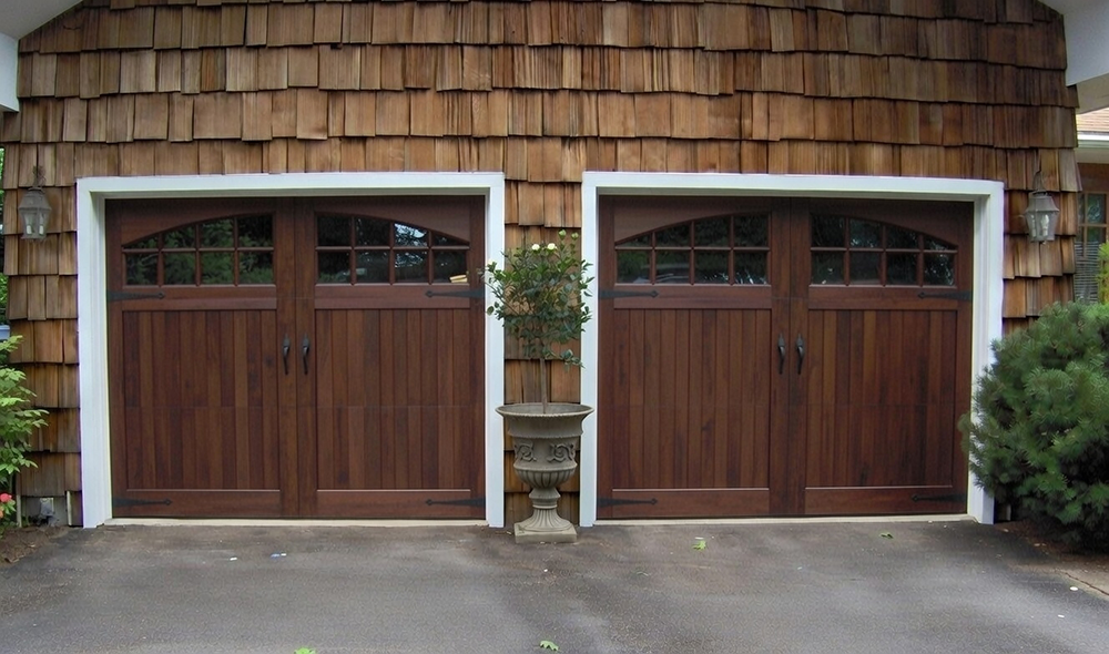 Cedar Shake Home Exterior Featuring Dark Wood Carriage-Style Designs With Arched Windows As Premium Garage Door Options, Installed By Lead Contractor Dmytro Shevchenko In North West Chicago