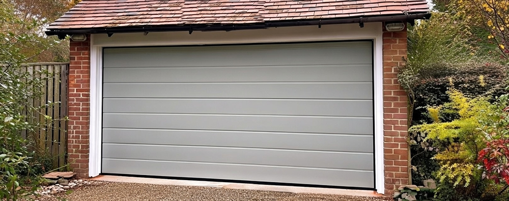New Style Garage Doors: 2026 Trends &Amp; Modern Designs For Chicago Homes Detached Brick Garage Featuring A Sleek Light Gray Horizontal Panel Design, Showcasing Modern Garage Door Options Installed By Lead Contractor Dmytro Shevchenko In North West Chicago.