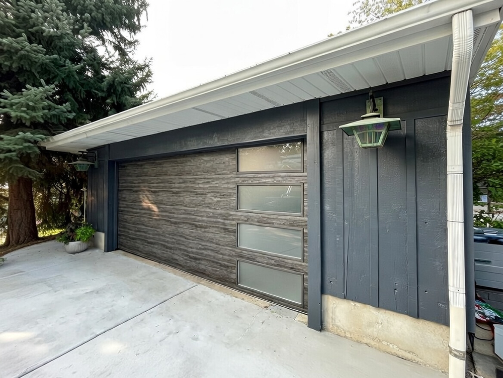 Modern Wood-Style Garage Door With Horizontal Frosted Glass Panels On A Detached Garage, Completed By Lead Contractor Dmytro Shevchenko In North West Chicago.