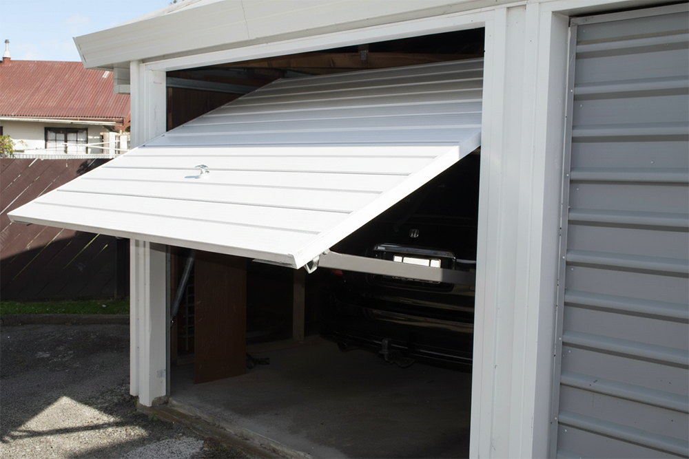 White Single-Panel Tilt-Up Design Shown Opening, Serving As An Example Of Traditional Garage Door Options Installed By Lead Contractor Dmytro Shevchenko In North West Chicago.
