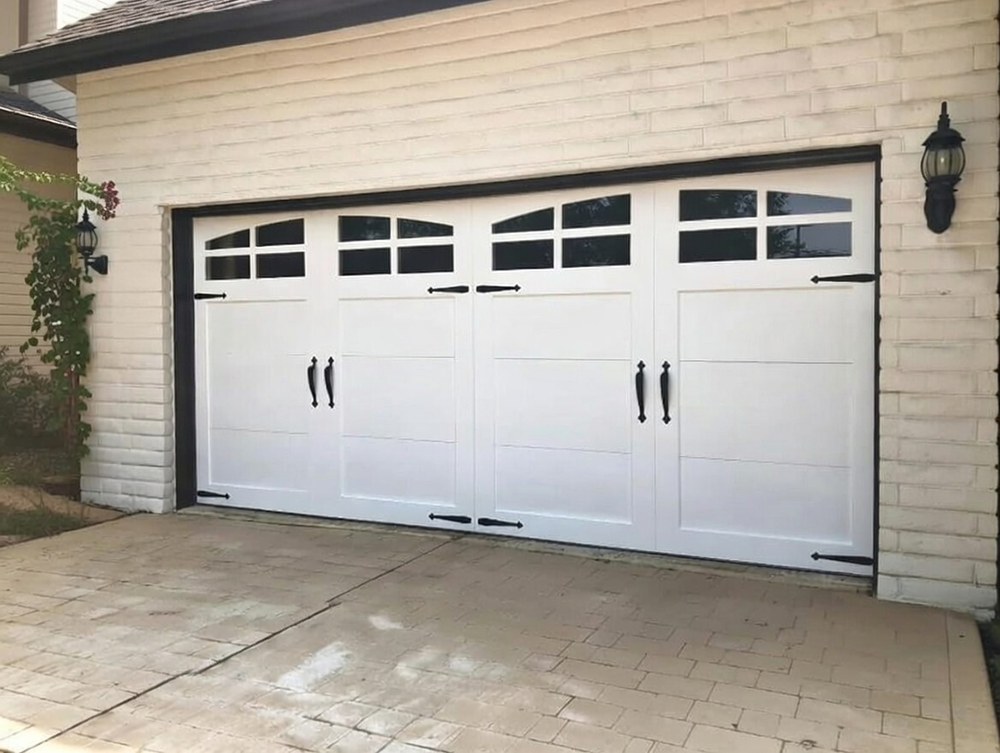 Double White Carriage-Style Garage Door With Arched Windows, Black Wrought Iron Hardware And Dummy Straps, Mounted On Light Brick Facade Home – Professional Installation By Lead Contractor Dmytro Shevchenko, North West Chicago