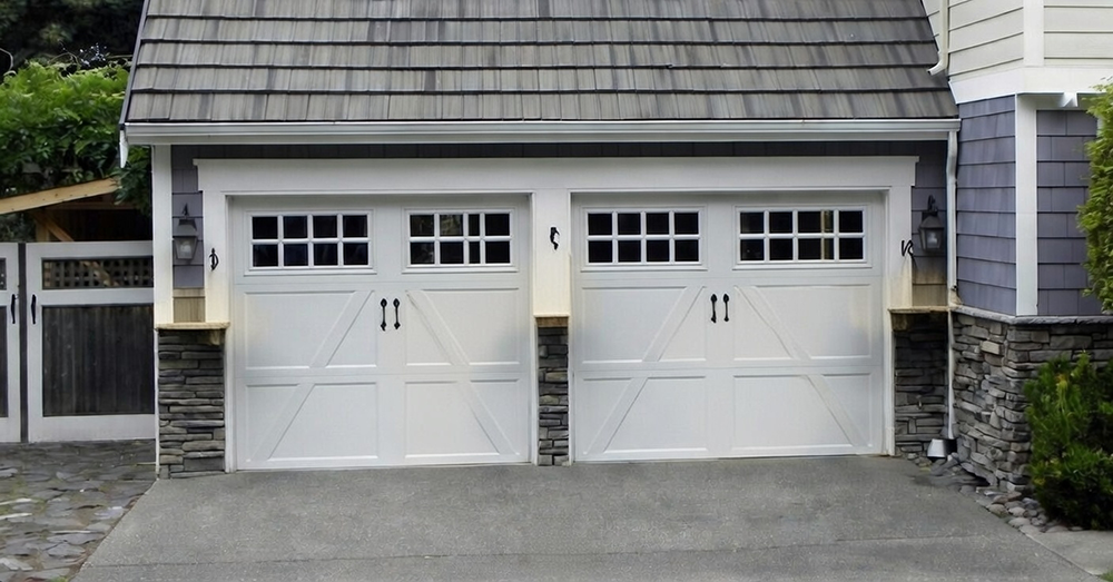 Home Exterior Featuring Dual White Carriage-Style Designs With Crossbuck Panels And Windows As Elegant Garage Door Options, Installed By Lead Contractor Dmytro Shevchenko In North West Chicago.