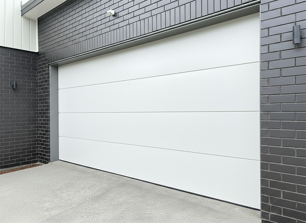 Modern White Flush-Panel Design Set Against Dark Brick, Showcasing Sleek Garage Door Options Installed By Lead Contractor Dmytro Shevchenko In North West Chicago.