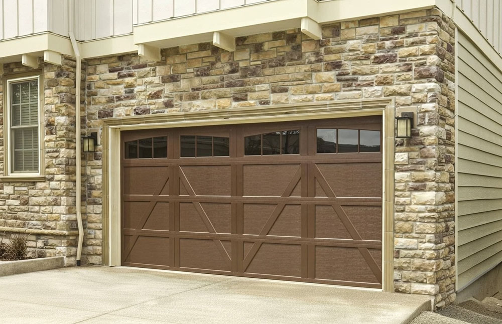Style Garage Doors: 2026 Guide To Popular Designs &Amp; Trends For Chicago Homes Stone Veneer Home Exterior Featuring A Brown Wood-Tone Carriage-Style Design With Crossbuck Panels, Showcasing Premium Garage Door Options Installed By Lead Contractor Dmytro Shevchenko In North West Chicago.