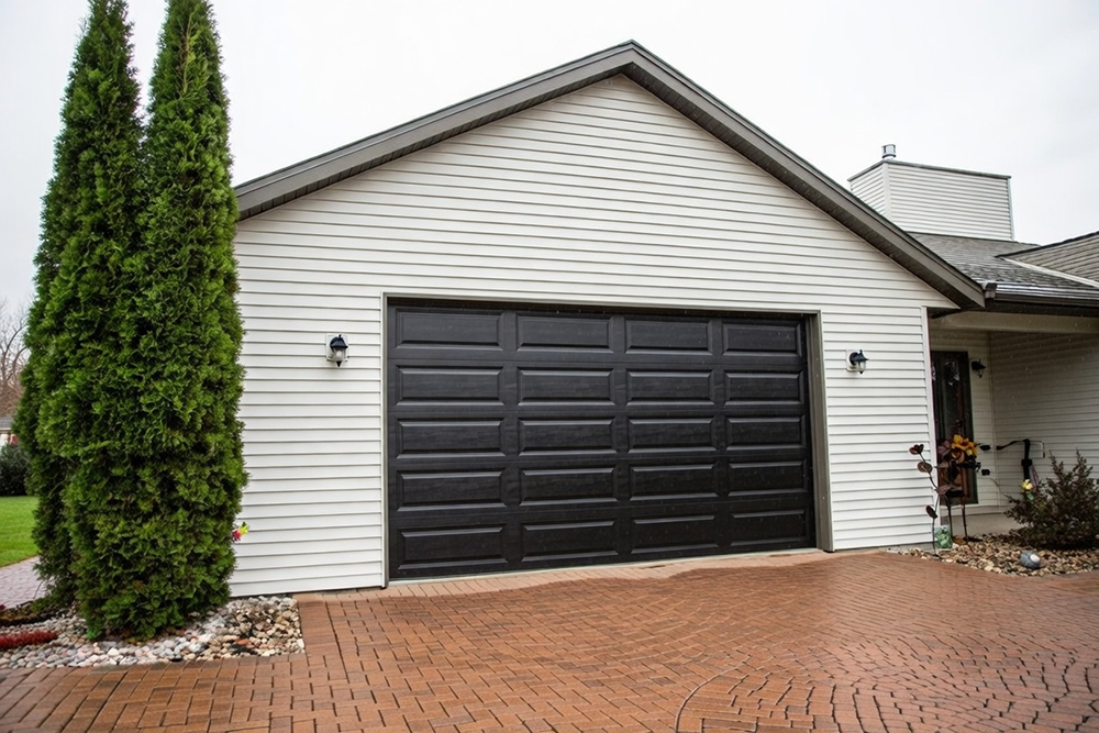 Residential Garage Door Designs: The Ultimate 2026 Style &Amp; Performance Guide Elegant Black Residential Garage Door Designs With Classic Raised Rectangular Panels On A White Siding Home With Gable Roof, Installed By Lead Contractor Dmytro Shevchenko In North West Chicago
