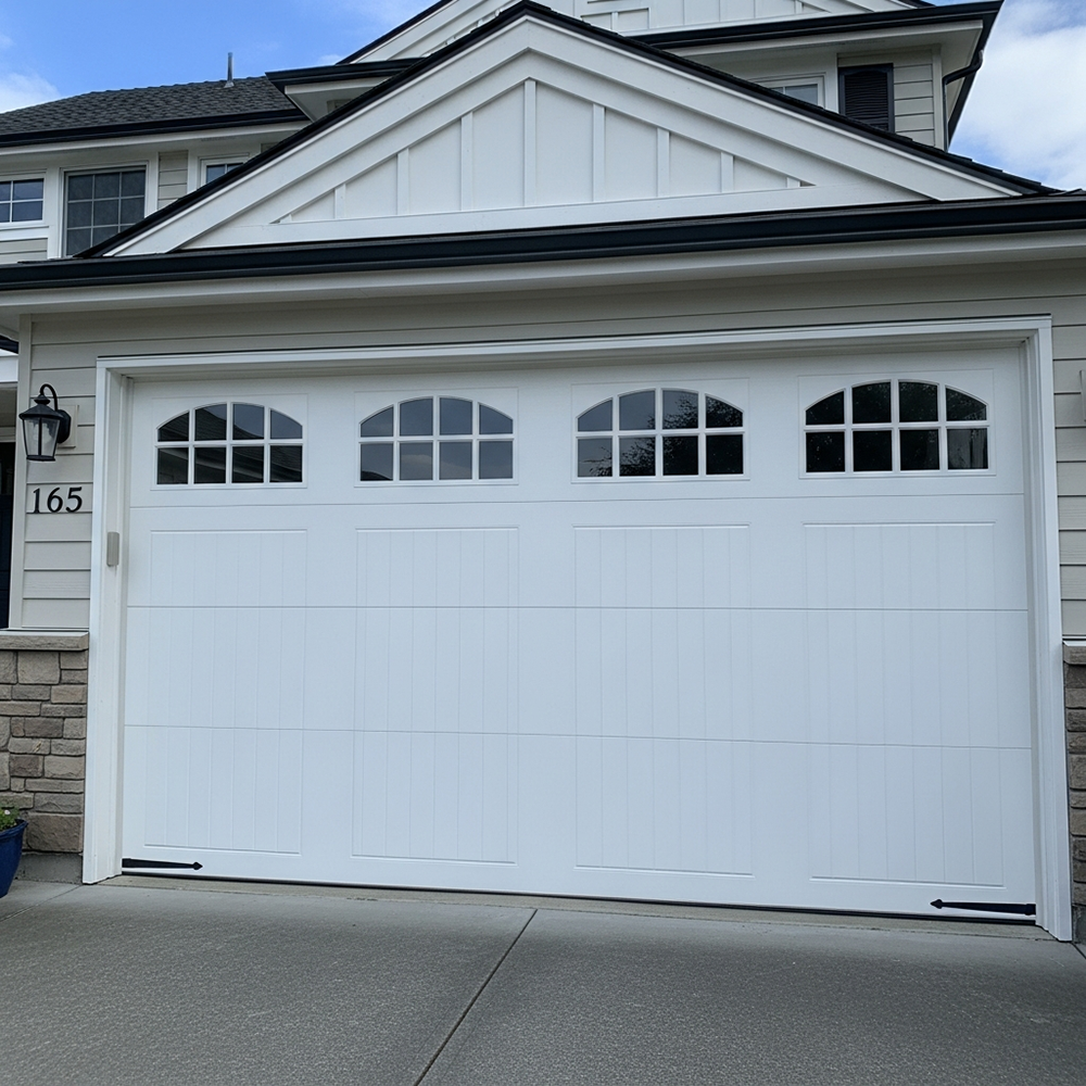 Traditional Garage Door Styles: The Timeless Choice For 2026 Traditional Garage Door Styles Featuring A Pristine White Raised-Panel Sectional Overhead Garage Door With Four Arched Multi-Pane Windows Across The Top, Vertical Board-And-Batten Lower Panels, Black Wrought-Iron Decorative Strap Hinges, Clean White Trim Frame, Installed On A Modern Two-Story Home With White Gable Accents, Brick Base, Address 165 Visible, North West Chicago. Lead Contractor Dmytro Shevchenko – Timeless Traditional Garage Door Styles.