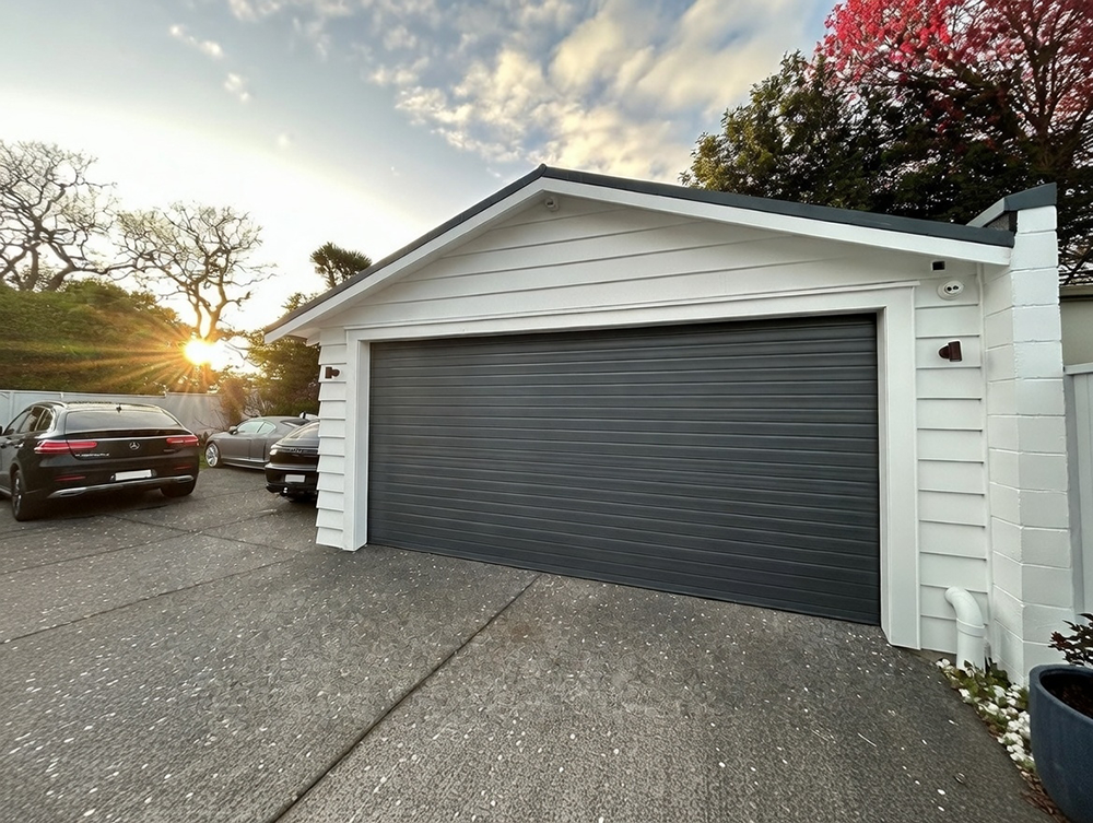 What Is A Garage Door Called? A Guide To Names And Terminology Example Of A Modern Dark Gray Roll-Up (Roller Shutter) Garage Door (Commonly Called A Roll-Up Garage Door) Installed On A Detached Single-Car Garage With White Shiplap Exterior At Sunset, By Lead Contractor Dmytro Shevchenko In North West Chicago. What Is A Garage Door Called? This Type Is Known As A Roll-Up Garage Door.