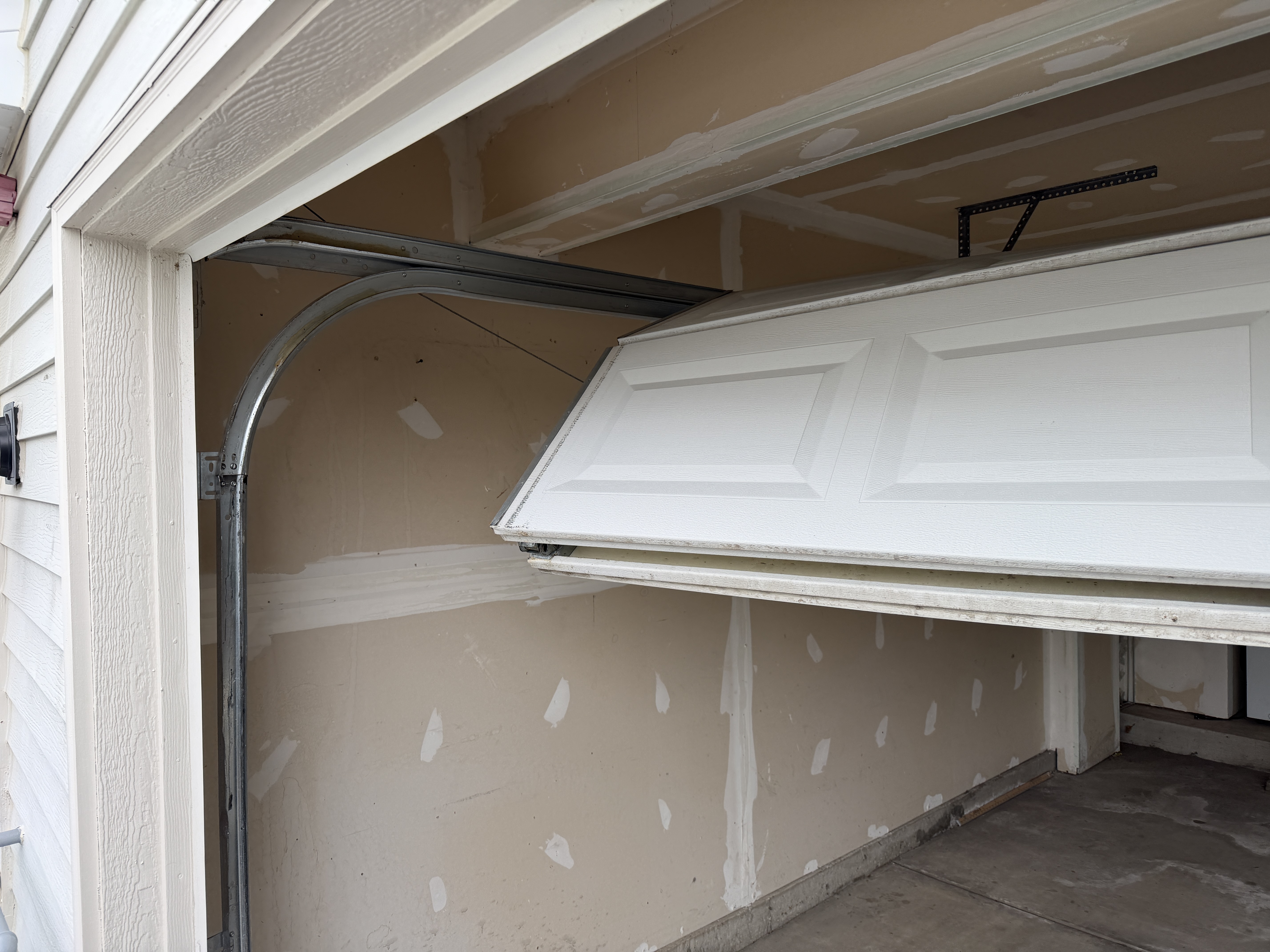 Garage Door Off-Track Repair And Reinforcement In Mundelein, Il Dmytro Shevchenko From Primegdr Checking Garage Door Tracks And Hardware During Repair